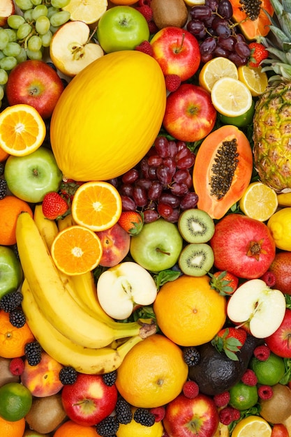 Colección de frutas fondo de alimentos formato vertical manzanas naranjas limones fruta fresca