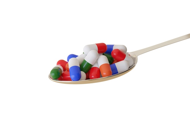 Colher cheia de comprimidos de cores diferentes, isolados em uma superfície branca.
