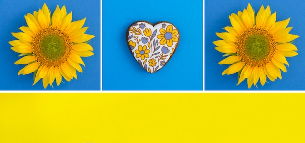 Collage de girasol y pan de jengibre en forma de corazón en el fondo de color Espacio de copia Vista superior