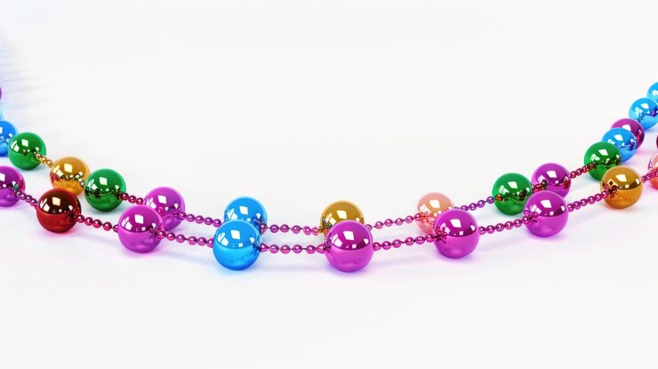 Foto collar de cuentas multicolores en una superficie blanca adecuado para conceptos de moda o joyería