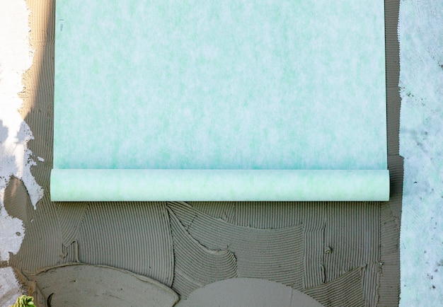 Foto colocação de um tapete de absorção de som na estilha