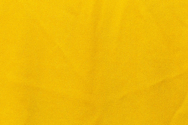 Color amarillo ropa deportiva tela camiseta de fútbol jersey textura y fondo textil