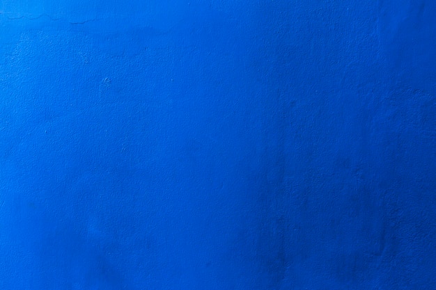 Color azul con una vieja textura de hormigón de pared grunge como fondo