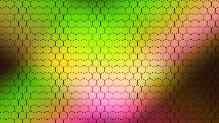 Foto un colorido patrón hexagonal con un fondo rosa.
