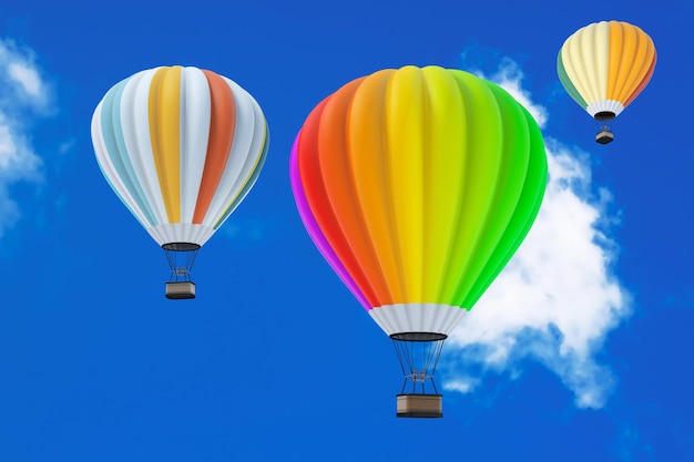Coloridos globos aerostáticos en vuelo sobre un fondo de cielo