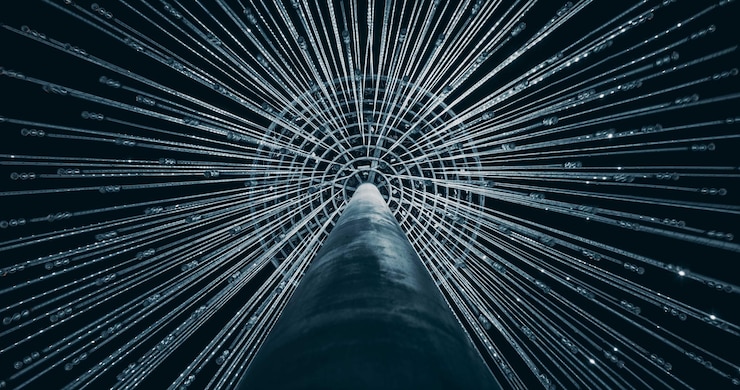 Foto una columna de cables que están conectados a un poste