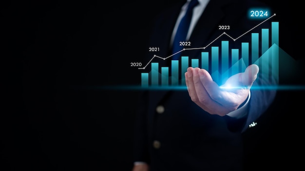 Comercio de acciones Finanzas Inversión Negocio en crecimiento Empresario con traje sostiene un gráfico virtual Representa el crecimiento de las acciones y los negocios en 2024