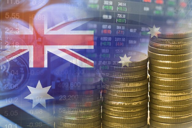 Foto comercio de inversiones en el mercado de valores financiero con monedas y bandera de australia concepto de negocio financiero