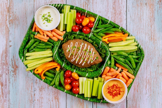 Comida de catering para fanático del juego de fútbol.