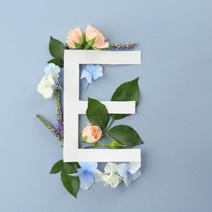 Foto composição com a letra e e lindas flores na cor de fundo