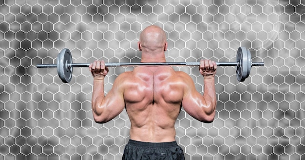 Foto composição da vista traseira de um homem musculoso levantando pesos com hexágonos em fundo cinza