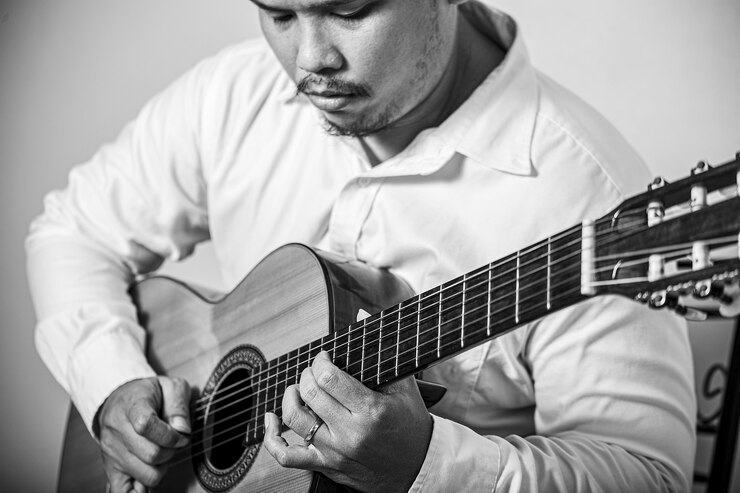 Foto composição de dedilhado de guitarra clássica em retrato