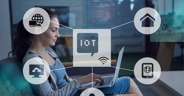 Composición del icono de iot con red de conexiones sobre mujer usando laptop