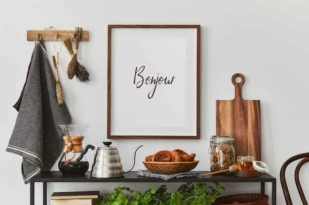 Composición interior de cocina elegante y acogedora con marco de póster simulado, consola negra, textiles de cocina, tetera, plantas y accesorios de inspiración retro. Plantilla. Vibraciones otoñales.