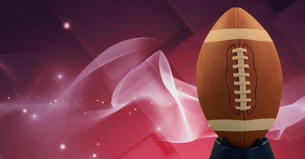 Composición de la pelota de rugby en la cancha con espacio de copia con manchas de luz sobre fondo rosa