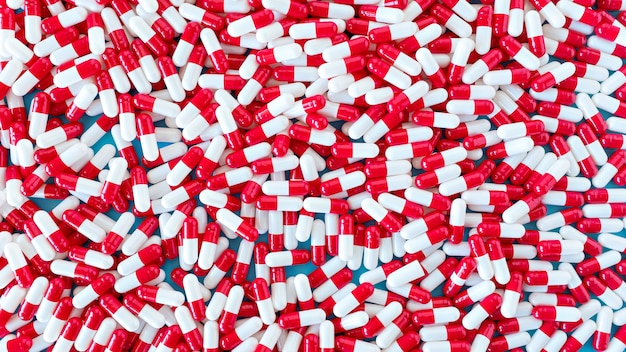 comprimidos de remédio branco e vermelho