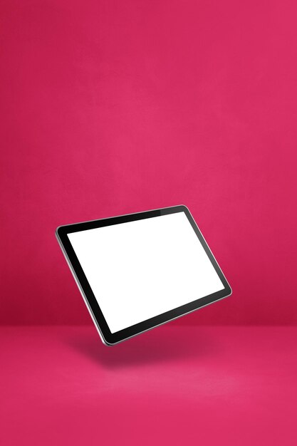 Computador tablet pc flutuante isolado em fundo vertical rosa