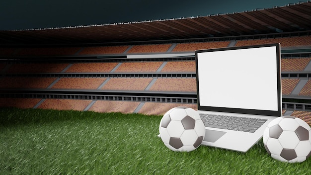 Una computadora portátil con una pelota de fútbol en el césped frente a un estadio.