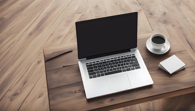 una computadora portátil y una taza de café en una mesa de madera