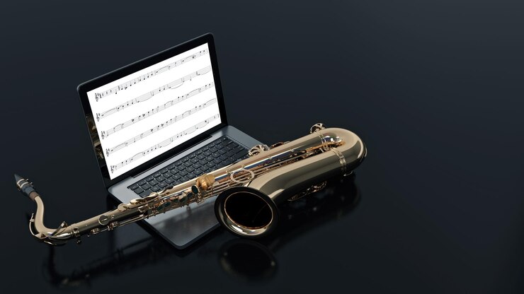 Foto computadora con saxofón