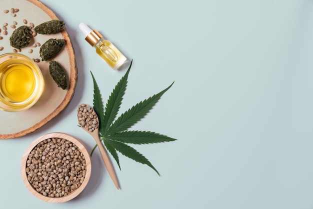Conceito de destilação do recurso de óleo CBD com sementes de cânhamo no fundo branco