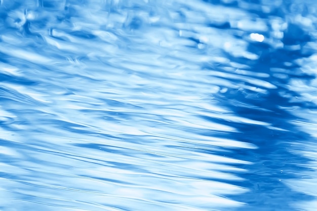 conceito de fundo abstrato azul água / oceano, ondas do lago na água, reflexo das ondulações no rio