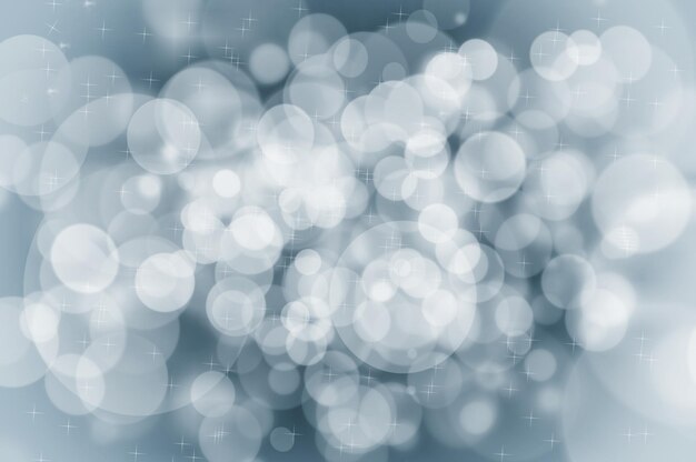 Conceito de fundo azul de Natal abstrato com flocos de neve e brilhos