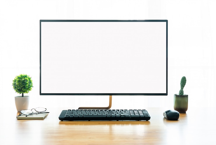 Foto conceito de local de trabalho: mock up desktop de computador de tela em branco