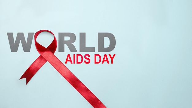 Conceito do Dia Mundial da Aids para conscientização da fita vermelha