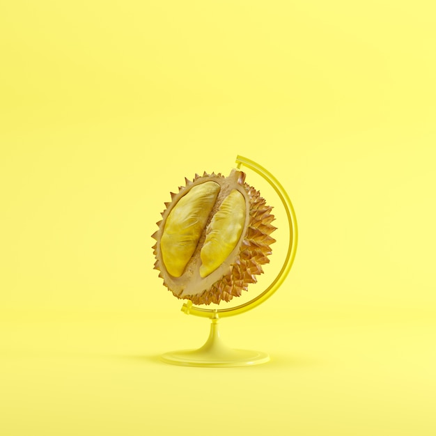 Conceito global da ideia do durian no fundo amarelo da cor pastel da cor.