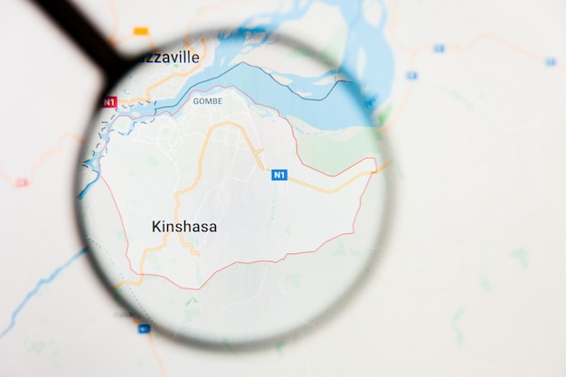 Conceito ilustrativo de visualização da cidade de Kinshasa, República Democrática do Congo na tela de exibição através de lupa