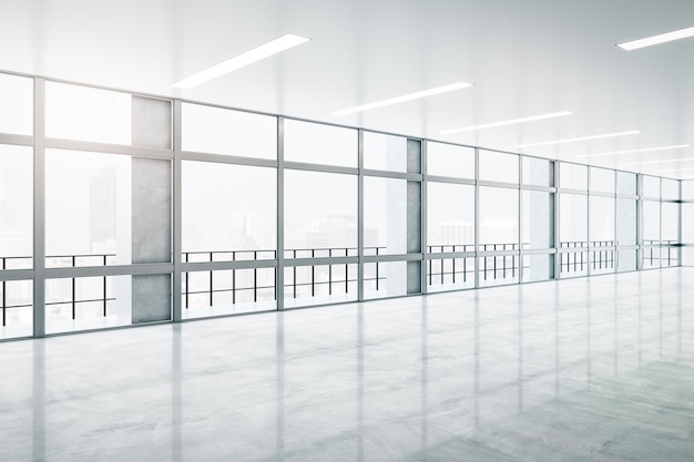 Conceito imobiliário com vista nebulosa da cidade a partir de grandes janelas em um espaçoso salão vazio com chão de concreto e teto claro renderização 3D