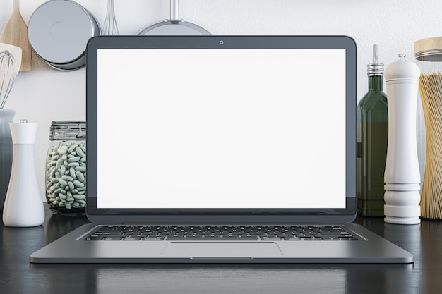 Concepto de clase magistral de cocina en línea con monitor de computadora portátil moderno blanco en blanco con espacio para su logotipo o publicidad de página web entre utensilios de cocina en maqueta de representación 3D de fondo de pared clara