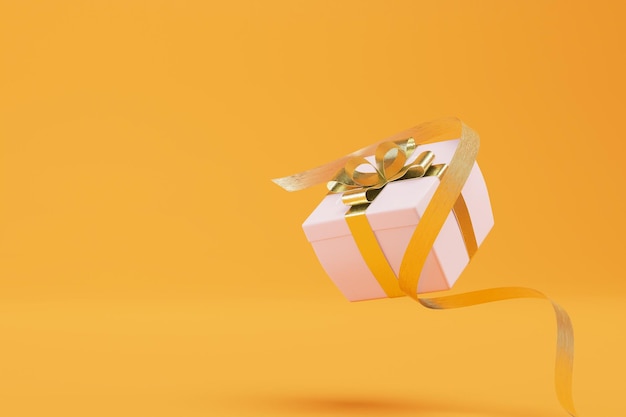 El concepto de comprar una caja de regalos con un regalo atado con una hermosa cinta en un fondo naranja