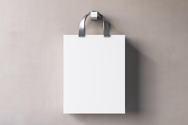 Concepto de compras o presente con vista frontal en una bolsa de artesanía blanca en blanco con asas plateadas y lugar para el logotipo de la empresa o texto publicitario sobre fondo de pared beige claro simulacro de representación 3D