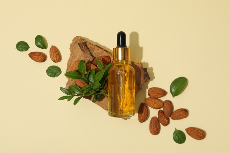 El concepto de cuidado de la piel y del cuerpo almendras aceite de almendras