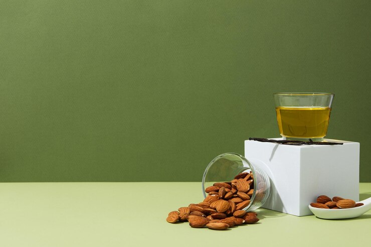 El concepto de cuidado de la piel y del cuerpo almendras aceite de almendras