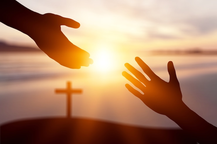 Foto concepto del día mundial de la paz: la silueta de jesús extendiendo la mano - imagen