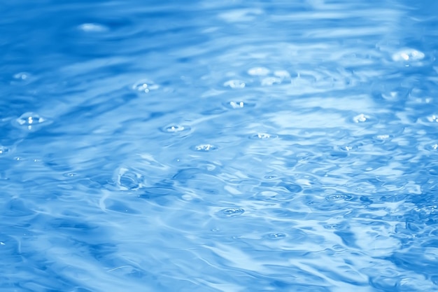 Concepto de fondo abstracto azul agua / océano, olas del lago en el agua, reflejo de ondas en el río