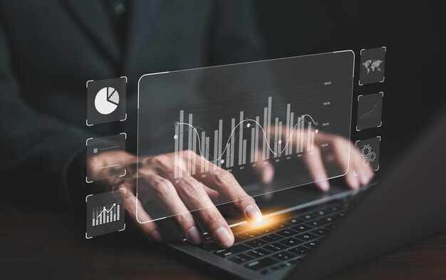 Concepto de gráfico de datos de informes financieros Empresario o analista que utiliza el panel de instrumentos KPI en pantalla con análisis de negocios y sistema de gestión de datos de la empresa Estrategia corporativa para el mercado financiero