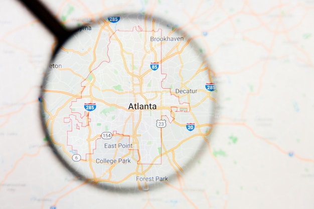 Concepto ilustrativo de visualización de la ciudad de Atlanta en la pantalla a través de una lupa