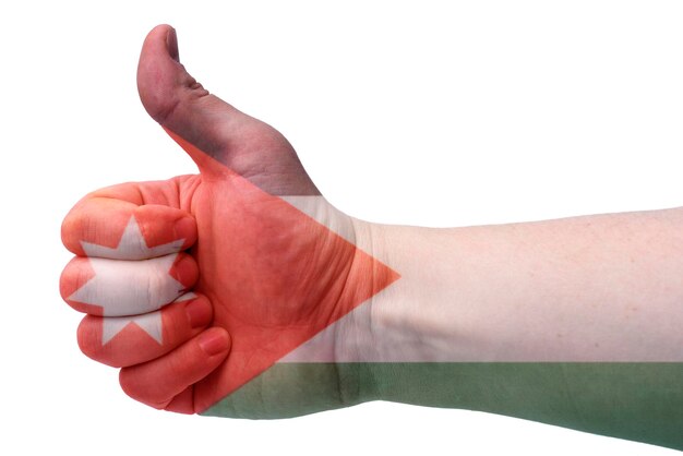 Foto el concepto de jordanla mano da un pulgar hacia arriba con la bandera de jordania