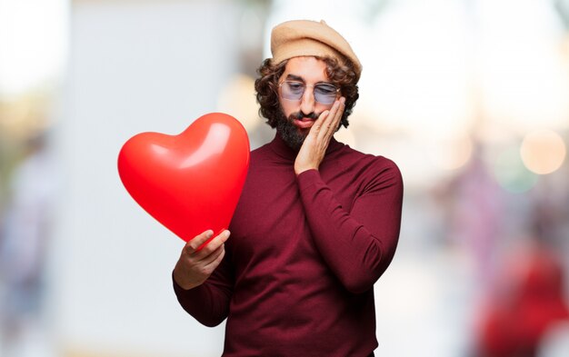 Concepto loco joven del día de tarjeta del día de San Valentín del hombre