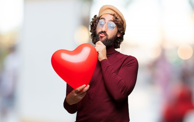 Concepto loco joven del día de tarjeta del día de San Valentín del hombre