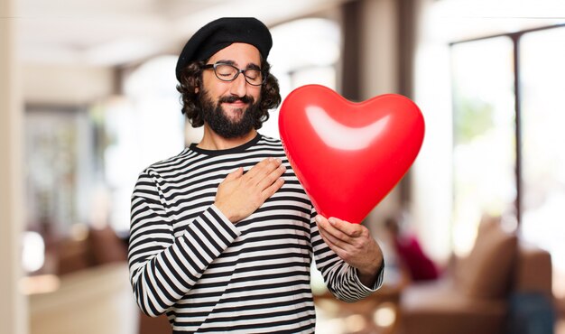 Concepto loco joven del día de tarjeta del día de San Valentín del hombre