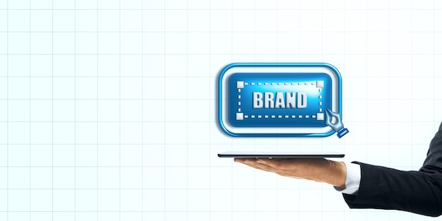 Concepto de marca digital representado por una tableta con un icono de marca en un fondo de cuadrícula de luz