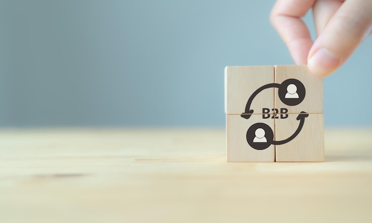 Foto concepto de marketing b2b b2b mantenga los cubos de madera con la abreviatura b2b y el icono en fondo gris y el espacio de copia concepto de modelo financiero y de marketing de negocios