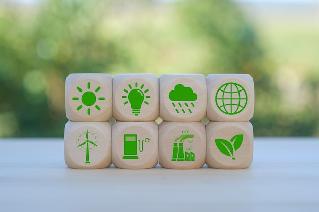 Concepto de medio ambiente de la Tierra Objetivo de cero emisiones netas de gases de efecto invernadero Estrategia a largo plazo de neutralidad climática Cubos de madera con icono de descarbonización e icono verde Bandera verde