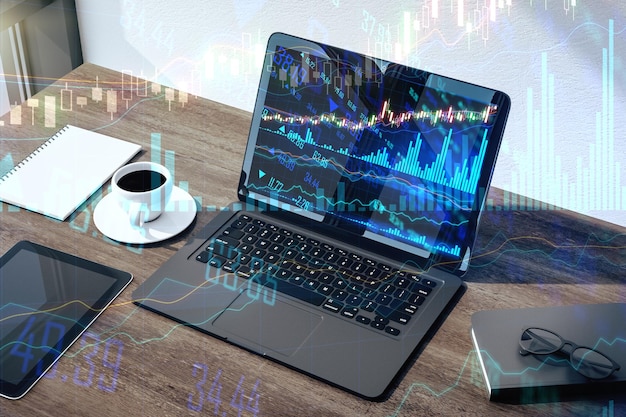 Concepto de negocio del mercado de valores en línea con una computadora portátil negra sobre una mesa de oficina de madera oscura con café y gráficos financieros y líneas del mercado de valores Representación 3D de doble exposición