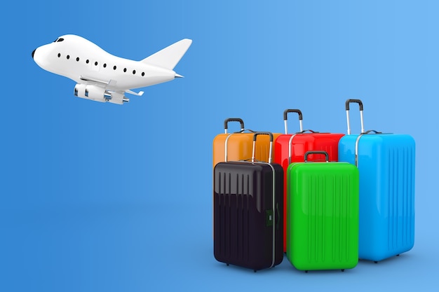 Concepto de viajes aéreos. Grandes maletas de policarbonato multicolor con avión de chorro de juguete de dibujos animados sobre un fondo azul. Representación 3D